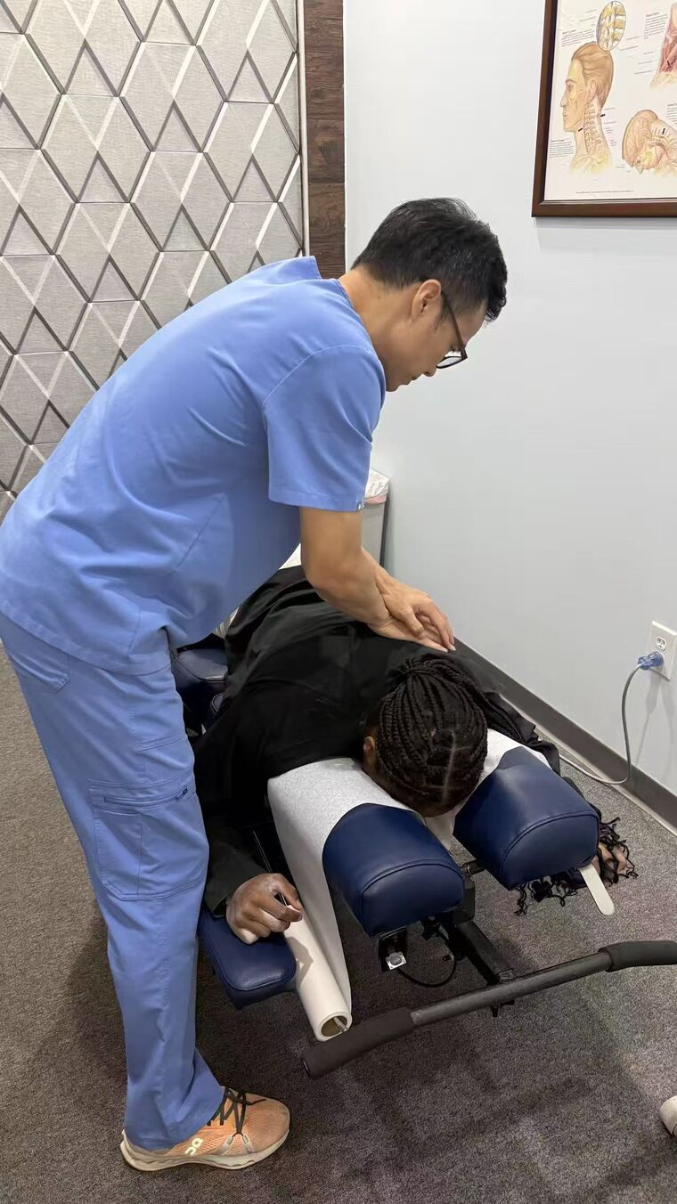 Dr. Zhan providing hands-on treatment