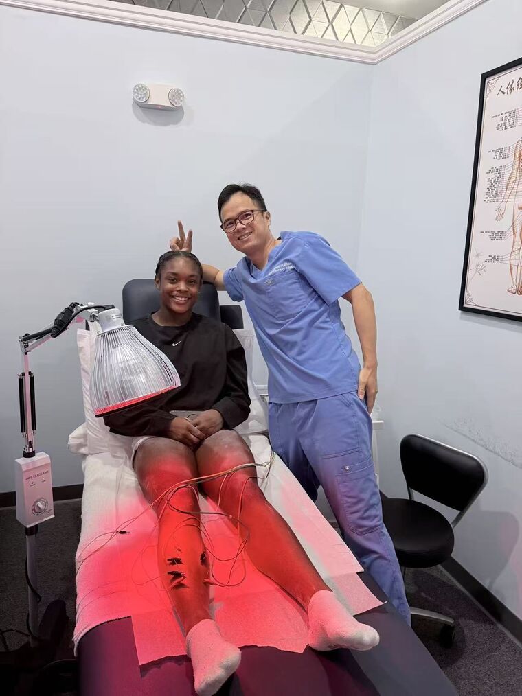 A patient receiving therapeutic modalities with Dr. Zhan